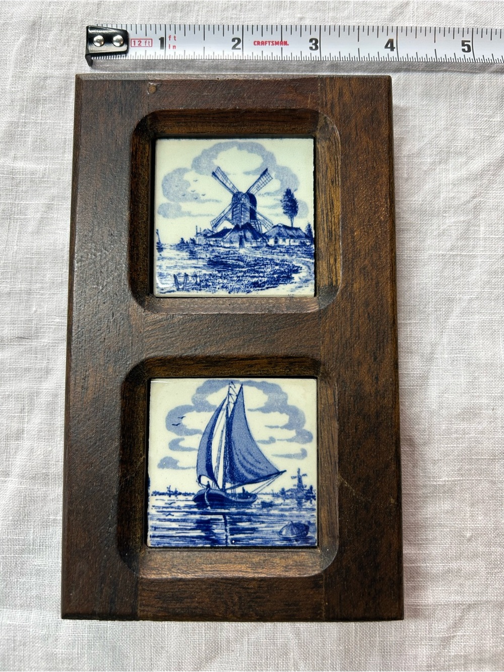 Wood Frame Wall Accent with Blue Delft Tile Insets of sailboat and windmill